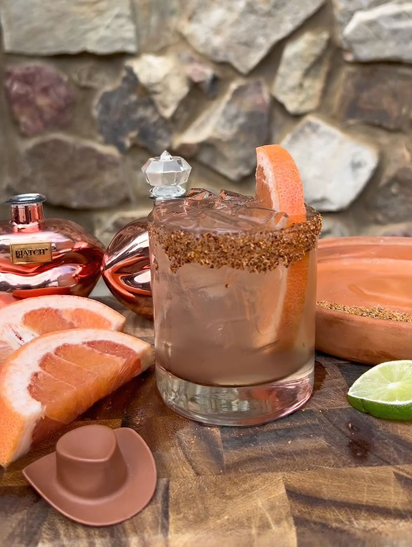 This vibrant cocktail mixes floral BIATCH rosa with tangy Fever Tree Sparkling Grapefruit, served in a Tajin-rimmed glass.