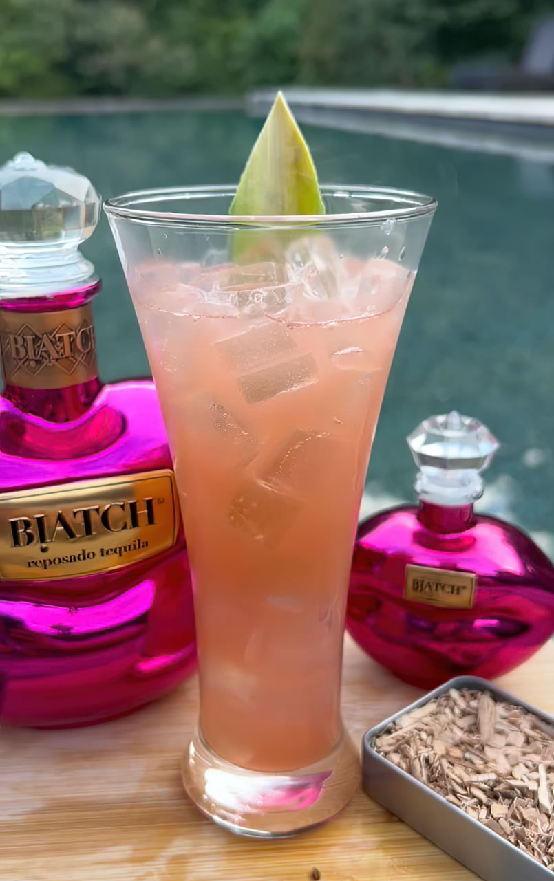 This smoky, tropical cocktail blends the rich flavors of BIATCH reposado with pineapple juice, Campari, lime, and orgeat and finishes with a hickory smoke.