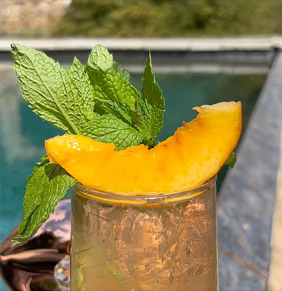 This refreshing cocktail mixes BIATCH rosa with peach cider, topped with mint and a peach slice for a light, summery touch.